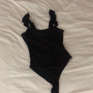 Black ribbed are a bodysuit